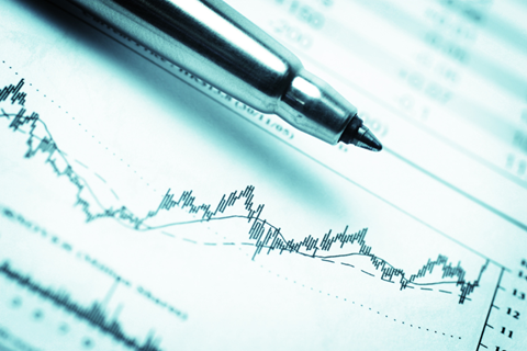 Ballpoint pen and graph indicating stock growth